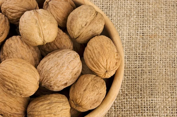 Walnuts in wooden bowl — Stock Photo, Image