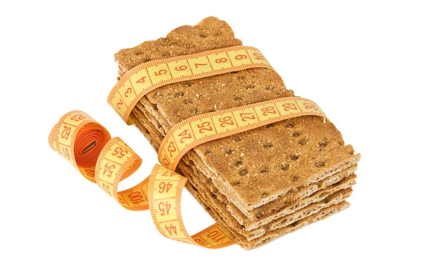 Flera knäckebröd bitar med måttband — Stockfoto