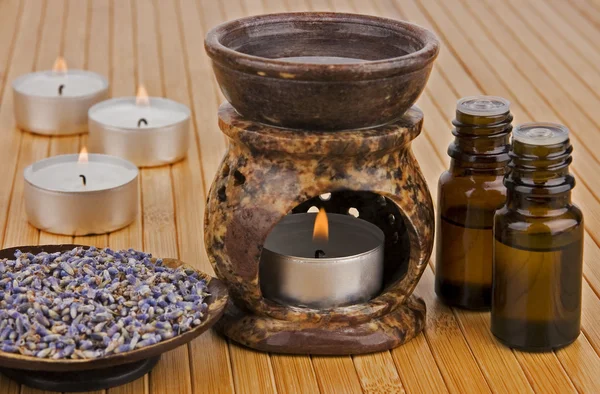 Aromatherapy lamp with oils and dried lavender — Stock Photo, Image