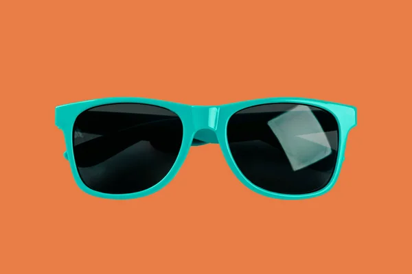 Blue Sunglasses Orange Background — Foto Stock
