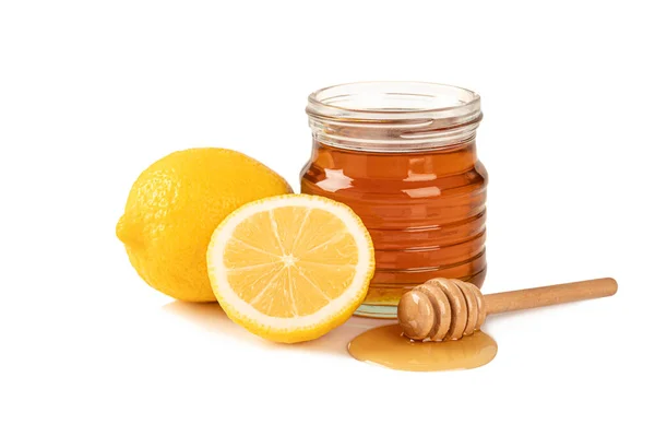 Beyaz arka planda izole edilmiş limonlu bal küpü. Sağlıklı beslenme