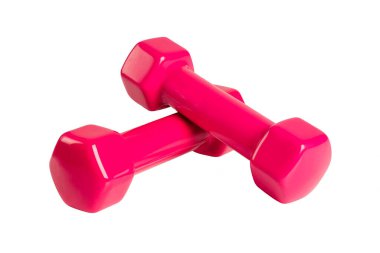 Beyaz arka planda izole edilmiş pembe dambıllar. Fitness geçmişi. Spor ve ev aletleri.. 