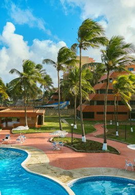 Top view of swimming pools on tropical beach in Caribbean hotel.