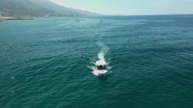 Aerial view of traditional fishing boat in Caraballeda with crystal clear turquoise sea, La Guaira, Venezuela.