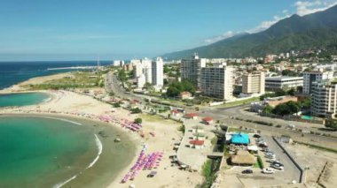 Aerial view picturesque public beach with turquoise water. Los Corales, La Guaira, Venezuela