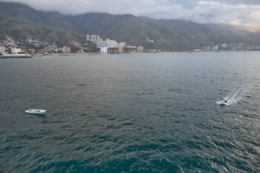 Aerial view of traditional fishing boat in Caraballeda with crystal clear turquoise sea, La Guaira. Venezuela.