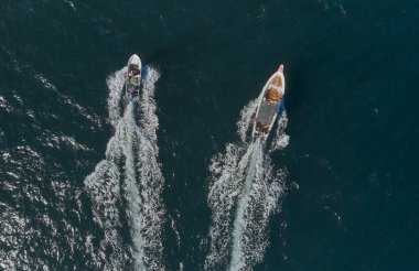 Aerial view of traditional fishing boat in Caraballeda with crystal clear turquoise sea, La Guaira. Venezuela.
