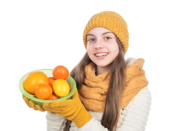 Teen girl need vitamins in winter. childhood happiness. small kid wear knitted scarf and gloves. — Stock Photo, Image