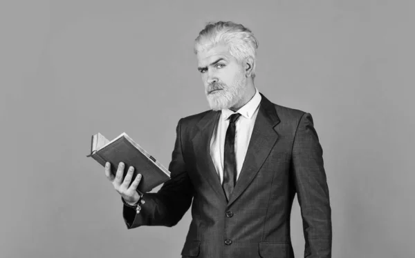 Feed the mind serious businessman hold notebook. mature man dyed beard and hair. reading book. check his notes. daily schedule. male professional teacher. after barbershop. business school education