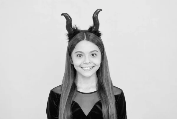 Cheerful kid having fun. carnival costume party. trick or treat. celebrate the holidays. cunning little demon. halloween devil girl. happy childhood. funny teenage child in imp horns — Stock Photo, Image