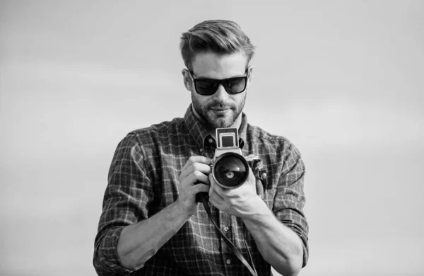 Flawless Moment. macho man with camera. photographer in glasses. travel with camera. male fashion style. looking trendy. sexy man touristic reporter. capture adventure. journalist