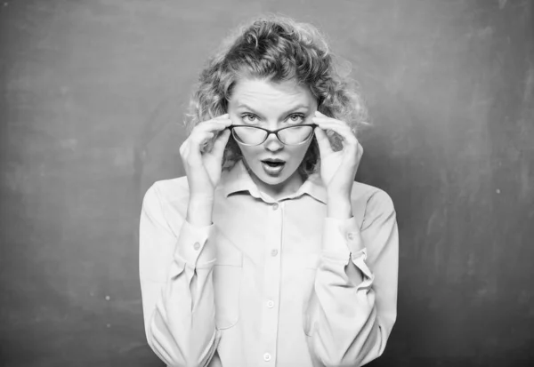 Adorable nerd. Woman school teacher shy and pretty lady wear eyeglasses chalkboard background. Sexy teacher concept. Smart girl teaching you. Let me see. Attractive educator. Playful teacher