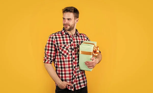 Young handsome man in shirt hold present box, anniversary — Stock Photo, Image