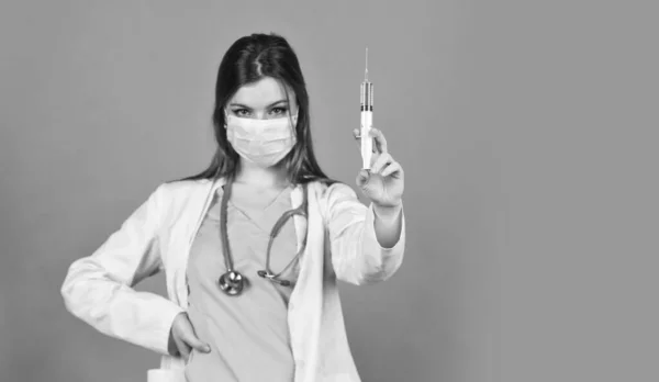 Immunity and health care. virus infection test. hpv vaccine. coronavirus epidemic from china. girl doctor use syringe in respirator mask. nurse make injection. flu or influenza. selective focus