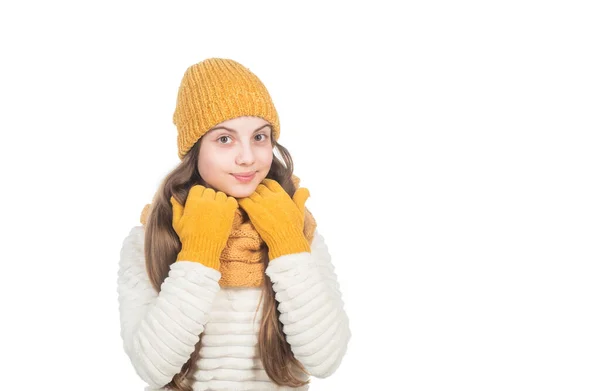 Cheerful teen girl in knitted hat scarf and gloves isolated on white copy space, cold weather. — Stock Photo, Image
