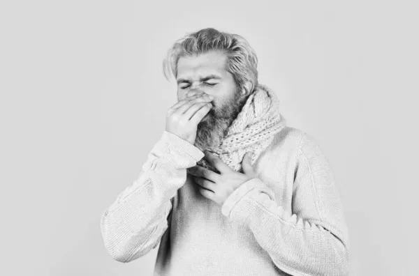 Hipster fever. Immune response. Bearded man sick. Warm scarf around neck. Cold flu fever concept. Body temperature. Fever and thermal regulation of immunity. More than just symptom of illness — Stock Photo, Image