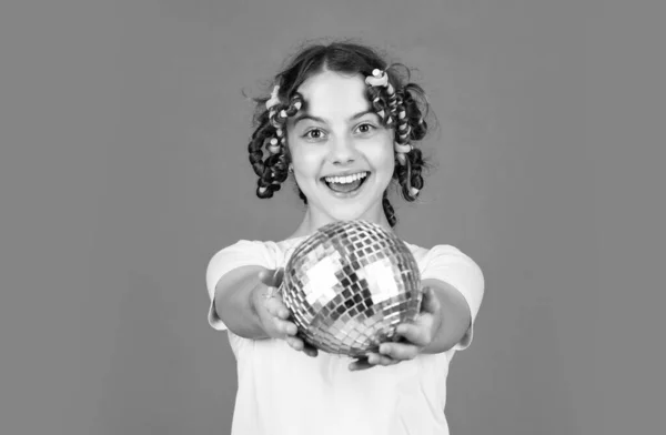 Saturday night and disco ball. baby shower party. lets have fun on retro party. disco ball decoration. lovely girl with disco ball. Fashion girl posing in curlers on orange background. happy birthday — Stock Photo, Image