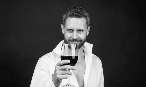Sexy man in unbuttoned shirt. guy drink red wine. cheers for happy valentines day. alcohol drinking. handsome male on romantic date. be my valentine. unshaven man with wine glass. sommelier — Stock Photo, Image