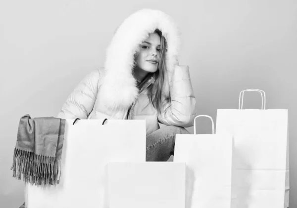 Sale and discount. Woman shopping try winter clothes. Shopping guide. Faux fur. Girl wear warm jacket. Shopping concept. Black friday. Personal stylist service. Buy winter clothes. Fashion boutique