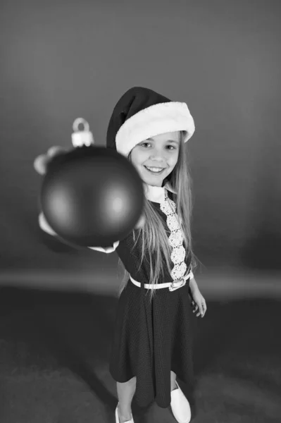 Happy child red costume hold christmas ornaments close up selective focus. Shop for decorations. Take it. Create unique decorations. Christmas ball decor. Christmas decorating ideas for kids room — Stock Photo, Image