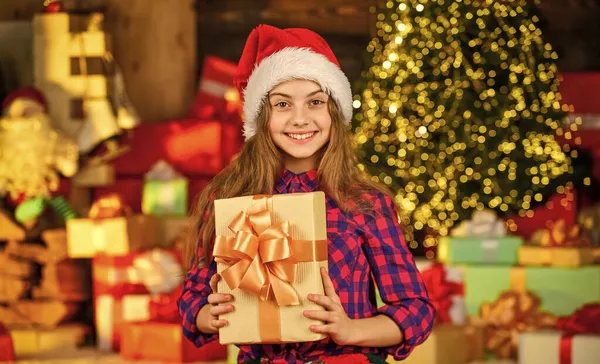 Time to celebrate. delivery christmas gifts. Beautiful decorated room with tree with presents under it. new year scene with tree and gifts. Celebration holiday party. small girl xmas online shopping — Stock Photo, Image