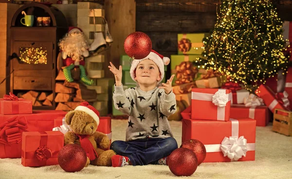 Happy child celebrate new year. Little boy play near christmas tree. Christmas eve. Kid fun home. Merry christmas everyone. Xmas present. Cute baby. Cherished dreams. Happy childhood. Winter holidays — Stock Photo, Image