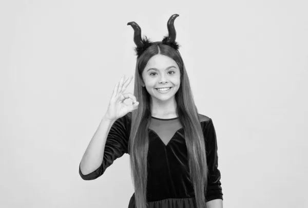 All will be ok. carnival costume party. trick or treat. celebrate the holidays. cunning little demon. halloween devil girl. happy childhood. funny teenage child in imp horns. cheerful kid having fun — Stock Photo, Image