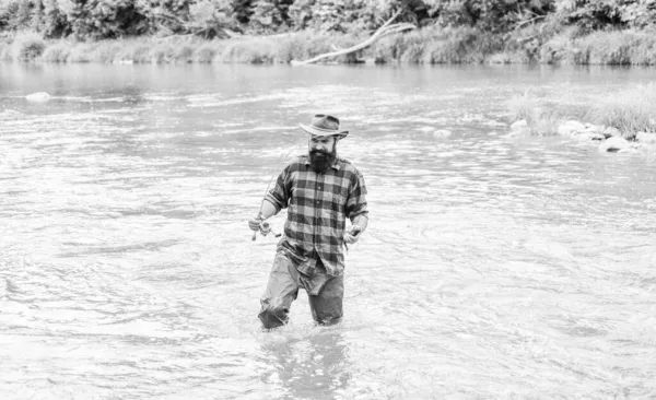 Be successful. hobby and sport activity. bearded fisher in water. fisherman show fishing technique use rod. mature man fly fishing. man catching fish. summer weekend. Successful fly fishing — Stock Photo, Image