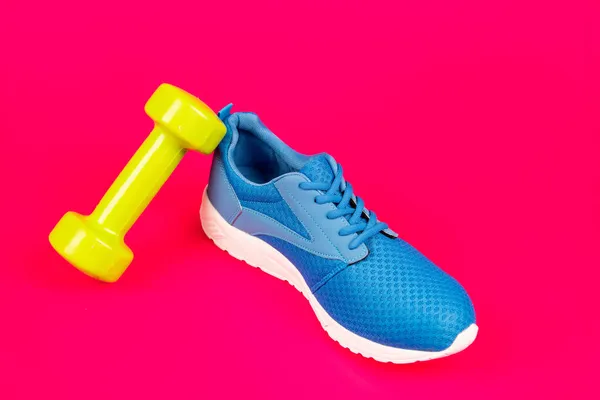 Footwear for training. athletic footgear for running. dumbbell sport accessory. — Stock Photo, Image