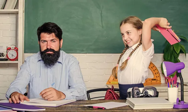 Study is fun. School teacher and schoolgirl. Homeschooling with father. Reward and punishment principle. Help study. Discipline and upbringing. Man bearded pedagogue study together with kid — Stock Photo, Image
