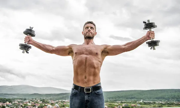 success. Perfect six pack. Muscular man exercising with barbell. athletic body. Dumbbell gym. fitness and sport. man sportsman with strong ab torso. steroids. good morning. Feeling free and confident
