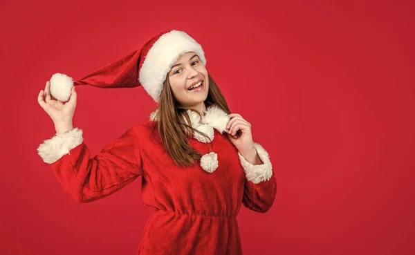 Happy new year. merry christmas. cheerful teen girl celebrate xmas party. kid wear red santa claus hat. child santa helper in costume. party fun. prepare for winter holiday — Stock Photo, Image