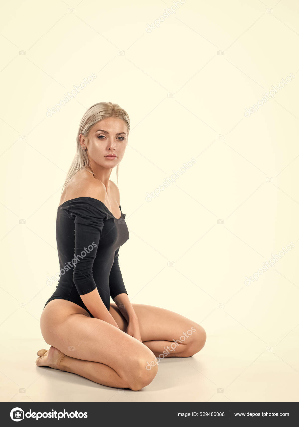 Lady in body suit with sexy smooth leg skin isolated on white