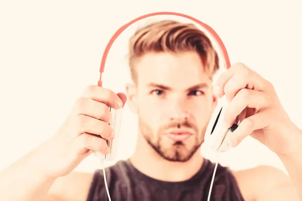 Modern music. new technology in modern life. sexy muscular man listen music. man listen new song isolated on white. unshaven man in blue tooth technology earphones. moder life concept — Stock Photo, Image