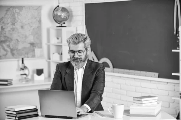 After classes. Degree certificate. Handsome hipster mature smart educator. Paperwork documentary files. School homework. Back to school. Knowledge day. Man work school teacher sit in classroom — Stock Photo, Image