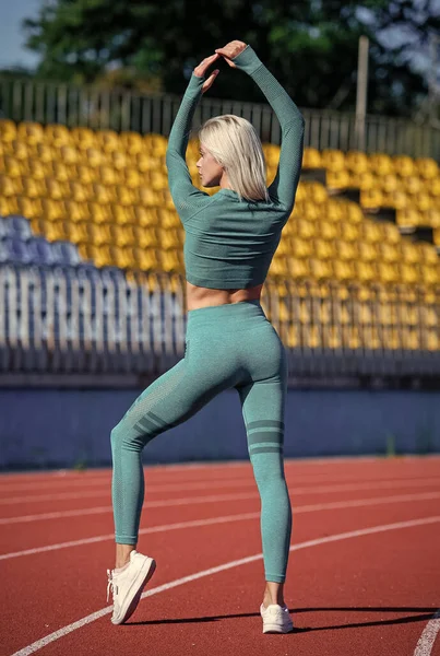 Perfect body shape. healthy and sporty. sexy fitness woman in sportswear. athletic lady with sexy ass at stadium. female athlete ready for sport workout. trainer or coach training — Stock fotografie
