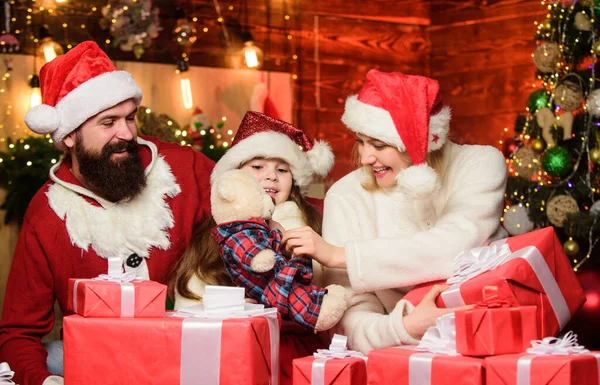 Christmas traditions concept. Father Santa claus costume with mom and little kid celebrating christmas. Christmas is the time to please. Joyful people. Gifts from Santa. Lovely daughter with parents — Stock Photo, Image