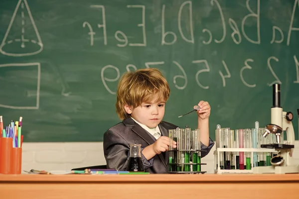 Biology science. science experiments with microscope in lab. school kid scientist studying science. Little boy is make science experiments. little boy at lesson. Back to school. Scientific researches — Stock Photo, Image