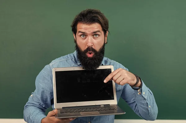 Surprised mature teacher working on computer. brutal bearded man work in classroom with laptop. online prepare for exam. college lecturer on private lesson. back to school. online informal education — Stock Photo, Image