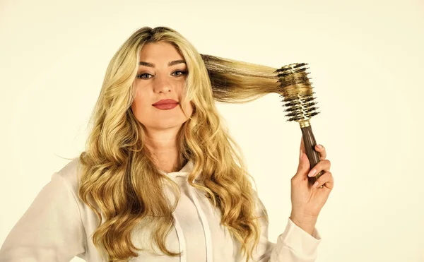 Hair today gone tomorrow. Girl care of hairstyle. Fashion and beauty. Stylist curling hair. fashion model woman. Girl With Gorgeous Healthy Smooth Hair Using hairbrush For Perfect Curls — Stock Photo, Image