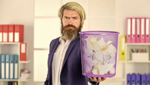 man read piece of paper. office worker digging in garbage bin. businessman hold trashcan. man in office look for lost note in paper bin. crumpled paper in wastepaper basket. selective focus