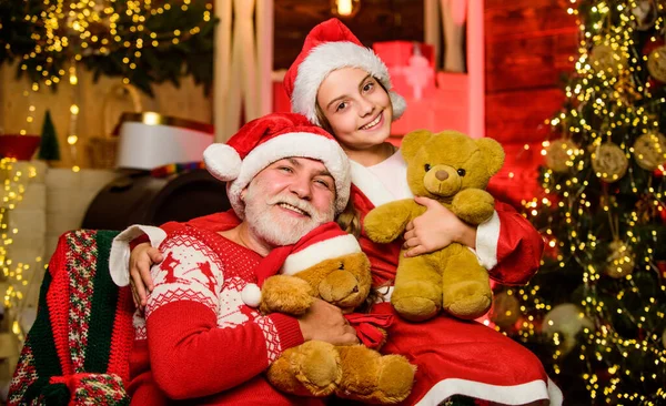 Happy childhood. Child christmas with Santa claus. Granddaughter spend time with grandpa. Christmas eve. Family home. Family relationships. Family tradition concept. Boxing day. Visiting grandparents — Stock Photo, Image