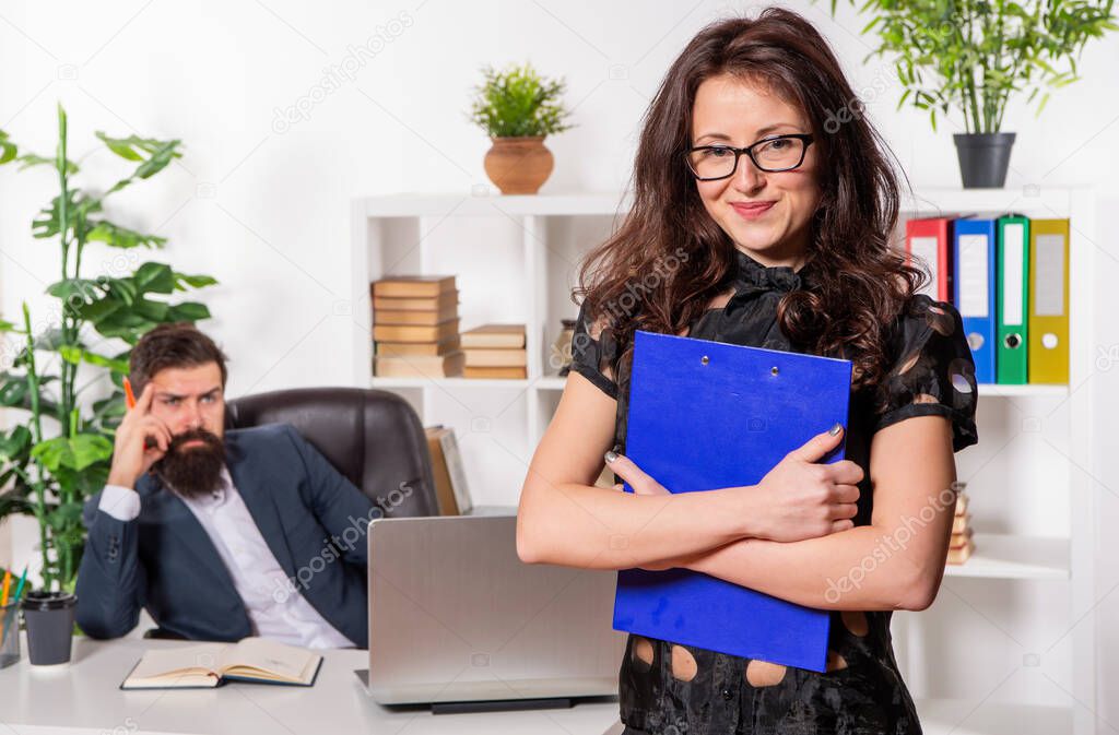 She sees possibility everywhere. Ambitious girl stand in front of boss working in office. Career girl