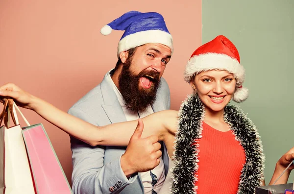 We are so happy. time for presents. happy family couple on xmas. santa man and woman with tinsel. christmas shopping sales. winter holidays celebrate together. happy new year party. gift with love — Stock Photo, Image