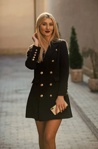 Blonde fashion blogger. elegant woman in jacket dress. glamour fashion look. sexy businesswoman outdoor. modern life. girl business style. glam and trendy female — Stock Photo, Image