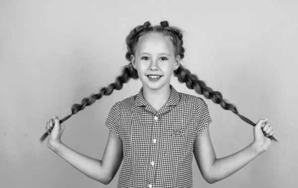 Smiling child with braided hair after hairdresser, beauty — Stock Photo, Image