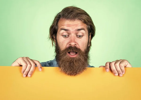 Amazed bearded brutal man with moustache hold paper shit for copy space, information — 스톡 사진