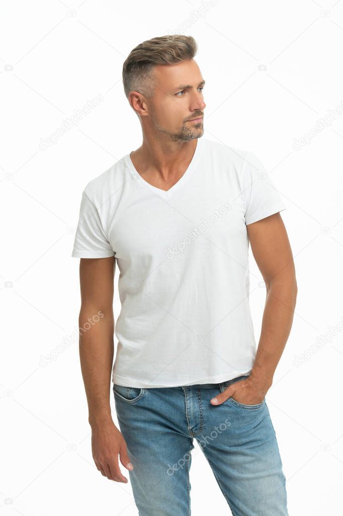 This is what handsome look like. Handsome guy in white tshirt. Caucasian man keep hand in pocket