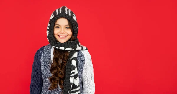 Portrait of child wearing warm clothes. express positive emotion. winter fashion. copy space — Fotografia de Stock