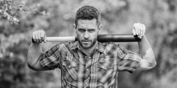 Principle concept. Confident in his strength. Bully guy in nature with cudgel. Wild energy. Power and strength. Feel my strength. Man unshaven strict face hold black baseball bat. Strong temper — Stock Photo, Image